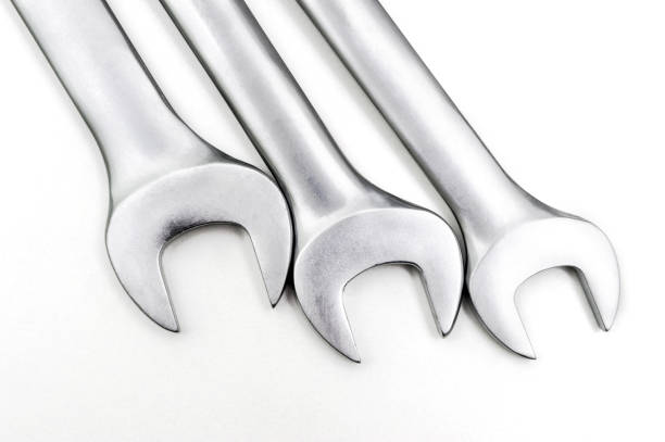 Spanner Set Isolated. Silver coloured spanners lying side by side in white background. stock photo