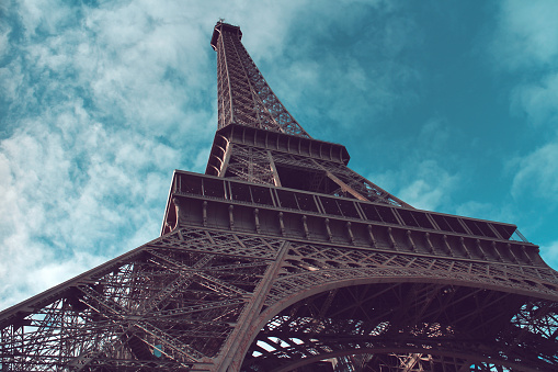 Vintage color Eiffel Tower low angle view, Paris, France.