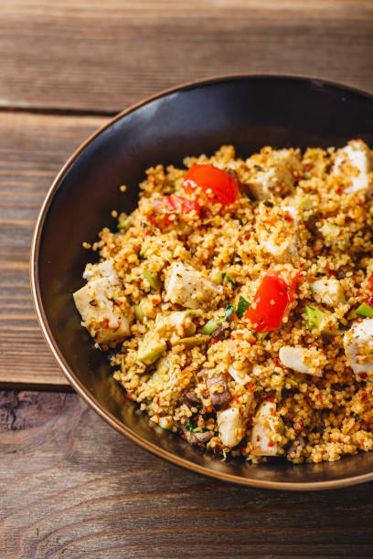istock Couscous with turkey, tomatoes, champignon mushrooms and avocado. 1256172867
