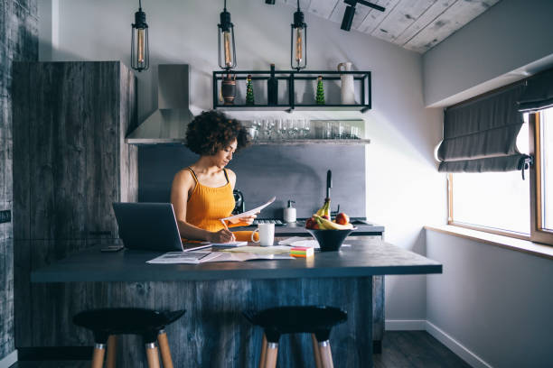istock Afro woman working from home during pandemic outbreak COVID-19 1256172934