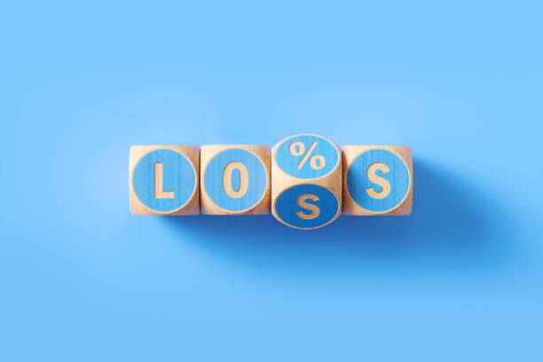 "Loss" and `Percentage Sign` Written Blue Wood Blocks Sitting over Blue Background "Loss and percentage sign" written blue wood blocks sitting over blue background. Horizontal composition with copy space. Loss concept. capital letter photos stock pictures, royalty-free photos & images