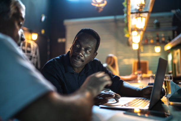 istock Colleagues doing a business meeting in a pub 1256173129