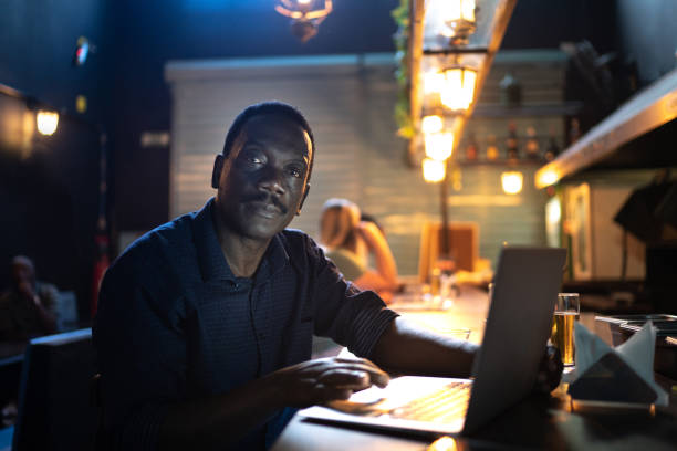 istock Portrait of a senior man working in a restaurant, using laptot 1256173130