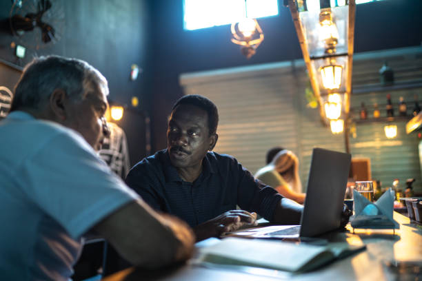 Colleagues doing a business meeting in a pub
