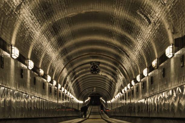 istock Alter Elbtunnel in Hamburg centered with pedestrian 1256173205