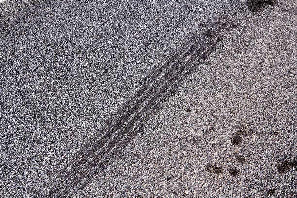Tire tracks on a asphalt road, abstract background