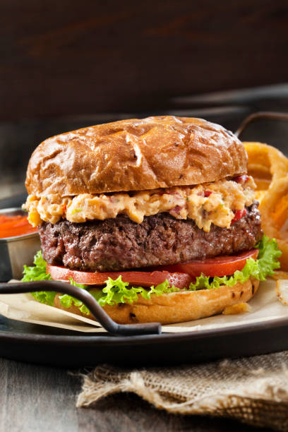 istock Pimento Cheese Burger with Lettuce, Tomato and Thick Cut Onion Rings 1256175994