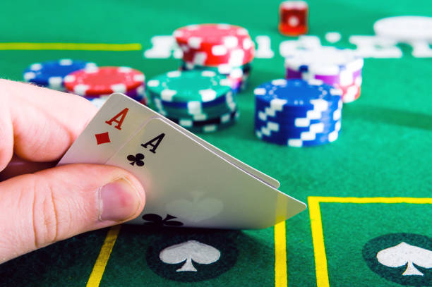 istock A man shows his deck of aces during a poker game, 1256177277