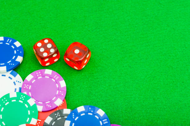 istock close-up poker chips and dice on the green baize table with copy space 1256178193