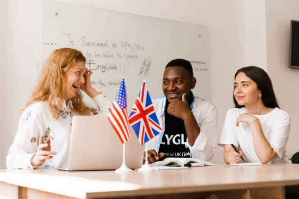 istock Online multiethnic attractive group of teachers study and laught, discuss something. Remote work in multinational group with laptop. Happy girls and black man speaking online by laptop 1256178524