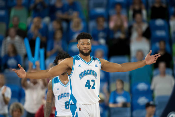 istock Basketball player with arms outstretch 1256181610
