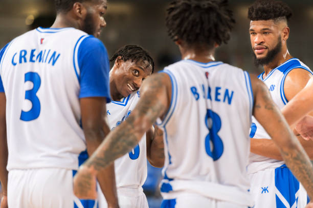 istock Basketball players discussing strategy 1256181845