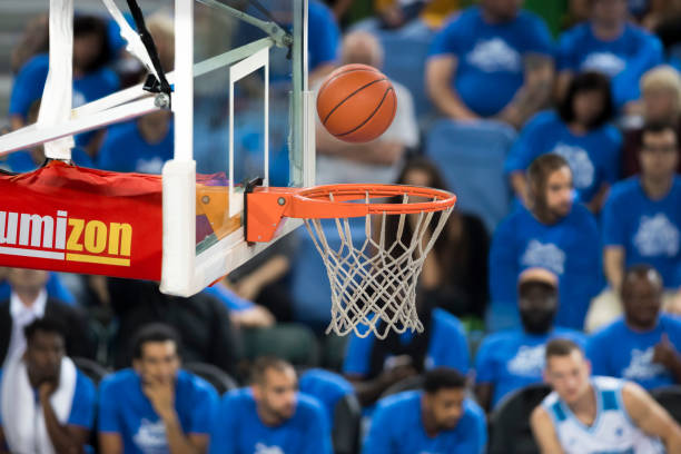 istock Basketball going into basketball hoop 1256182426