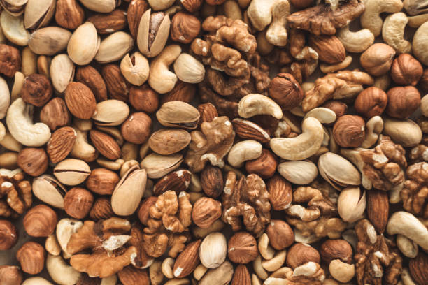 istock Different types of nuts, nut mix of almonds, hazelnuts, cashews, peanuts 1256182442