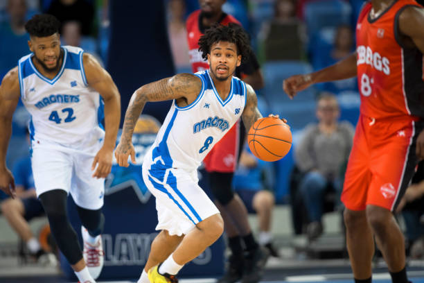 istock Basketball player dribbling ball 1256182567