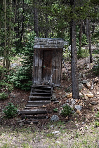 Abandoned old wooden outhouse building