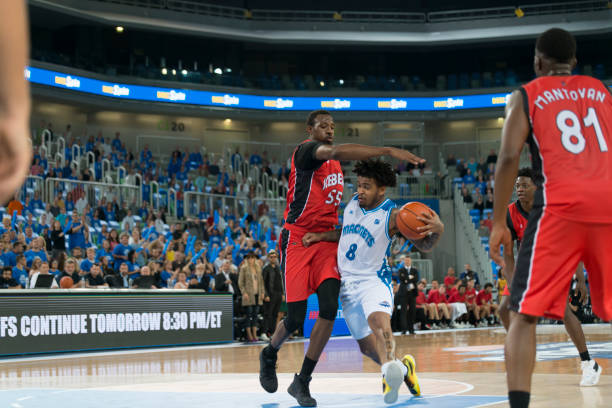 istock Basketball player trying to block opposite team player 1256185635