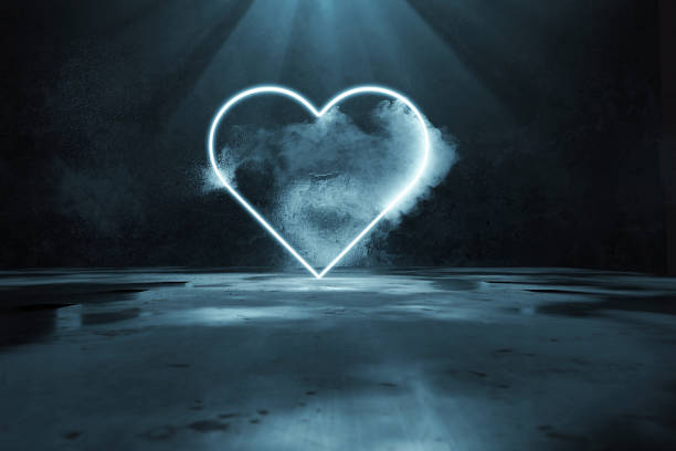 istock 3d rendering of blue lighten heart shape with light rays in front of grunge wall background and puddles 1256191412