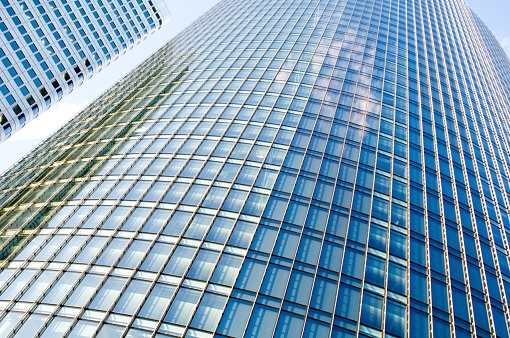 abstract glass facade of a high-rise building in the banking district