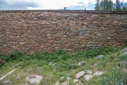 Stone wall Abandoned old wooden building