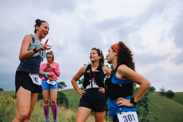 istock Group of female runners chatting after a race 1256193546