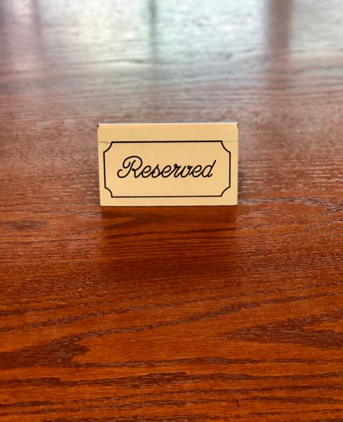 istock Reserved sign on a wood table 1256193586