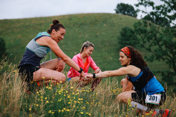 istock Group of female runners resting after a race 1256193727
