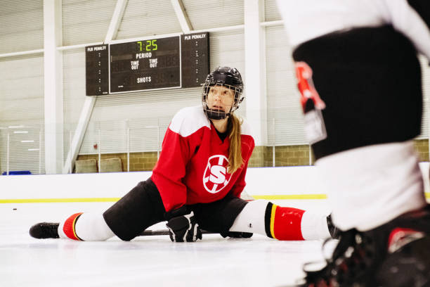 istock Woman Hockey Player Stretching 1256197622