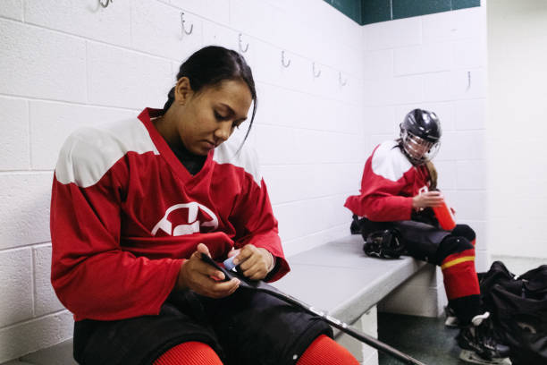 istock Women's Hockey Team in a Locker Room 1256197641
