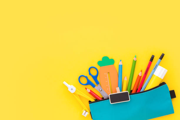 istock Pencil case on yellow background. Back to school concept. 1256202287