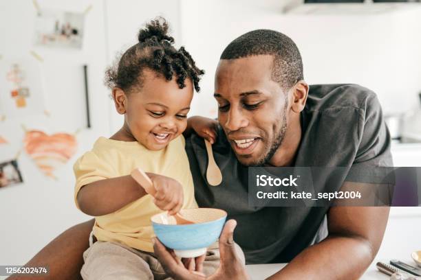 Dad Taking Care Of His Baby During Lockdown Stock Photo - Download Image Now - Father, African-American Ethnicity, Child Care