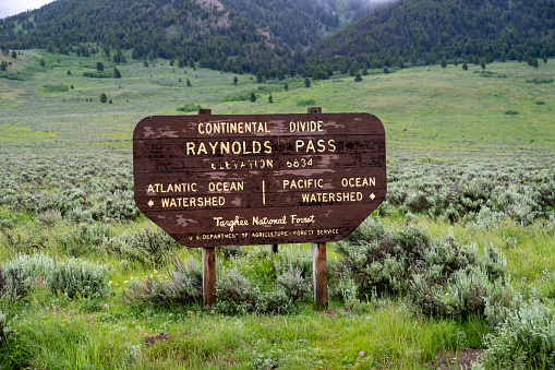 Continental Divide - Raynolds Pass sign in the Targhee National Forest on the Idaho and Montana border along Highway 87