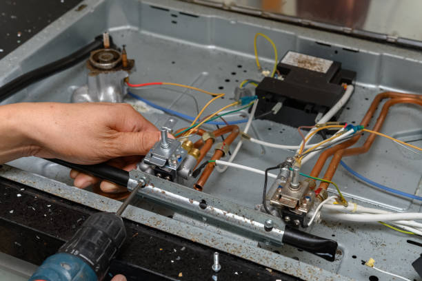 istock man fixing a gas cooker 1256210981
