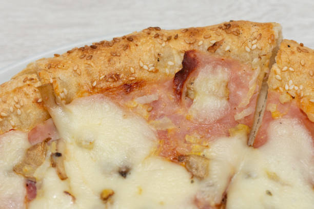 istock pizza Di Roma  with ham and sesame 1256211696