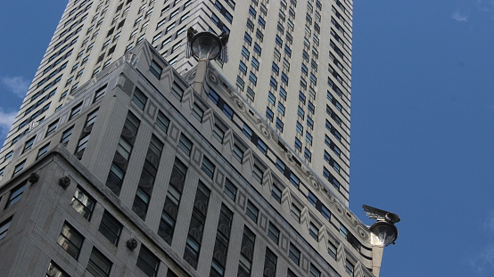 Close up of the windows and Art Deco details of the Chrysler Building with a clear blue sky on the back, Midtown Manhattan, New York City, United States of America