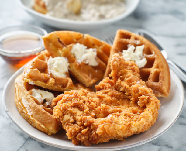 istock fried chicken and waffles breakfast with syrup 1256217134