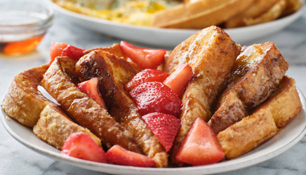 istock french toast with maple syrup and strawberries 1256217144
