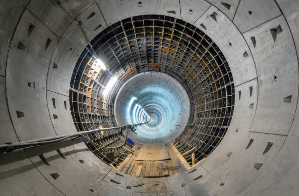 istock Construction of a new subway tunnel. Round tunnel with lighting 1256218932