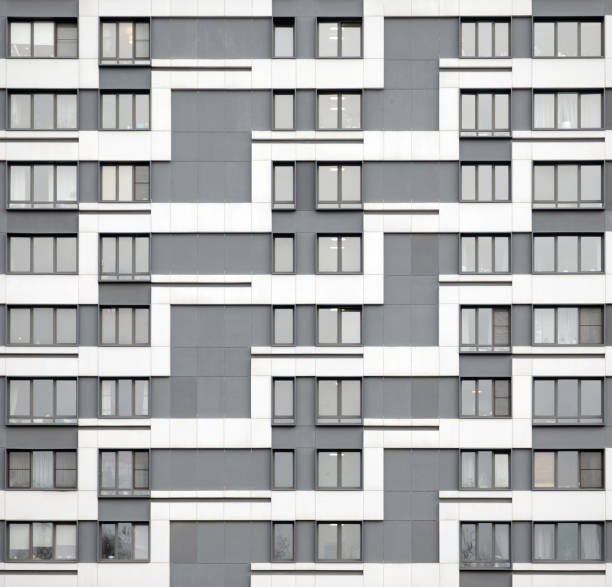 istock Grey and white facade of a residential building 1256219522