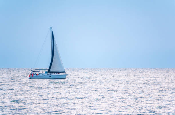 istock Sailing yacht in the blue calm sea. 1256228743