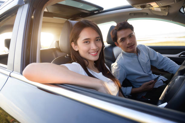 istock Happy young couple enjoying in drive 1256228841