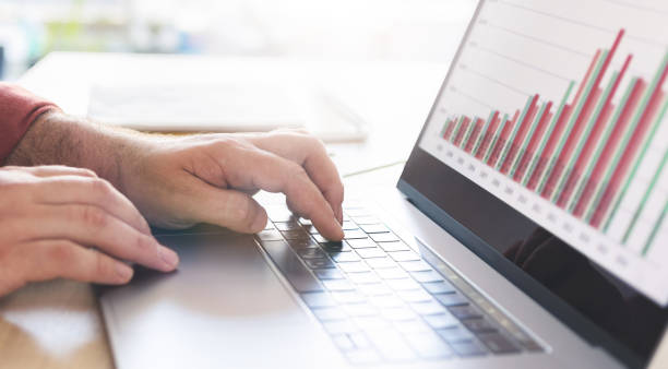 istock Male analyst analyzes report while sitting at home Remote work concept 1256235349