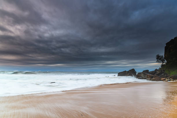 istock Moody Seascape with Large and Powerful Surf 1256237202