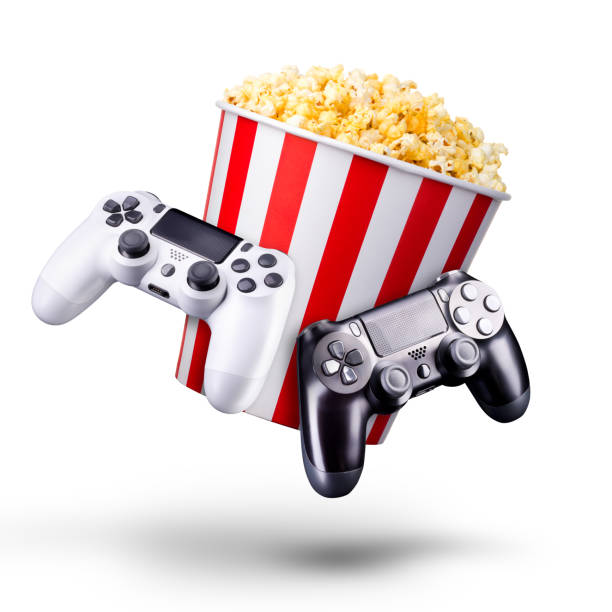 istock Flying popcorn and video game joystick gamepad isolated on a white background 1256237695
