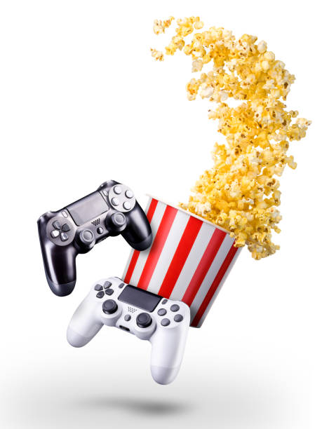 istock Flying popcorn and video game joystick gamepad isolated on a white background 1256237885
