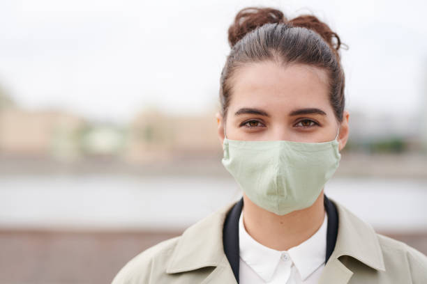 istock Attractive businesswoman in mask 1256242492