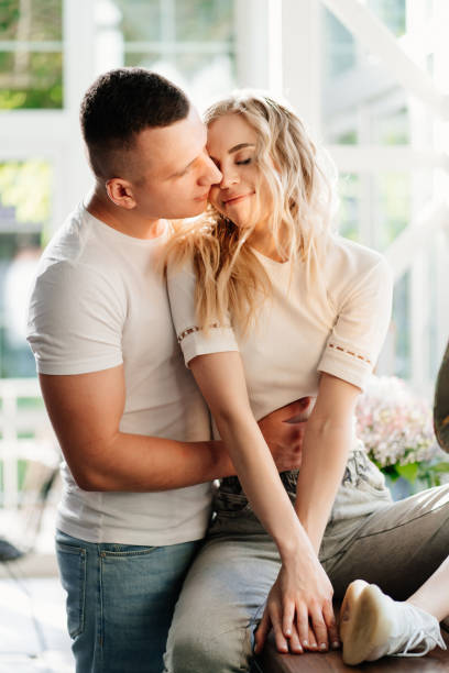 istock lovers beside ancient gramophone in sunlight from Windows. high key lighting 1256243549