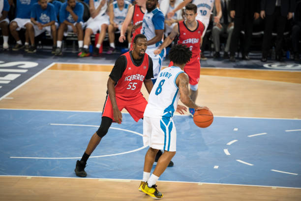 istock Basketball player trying to block opposite team player 1256246888