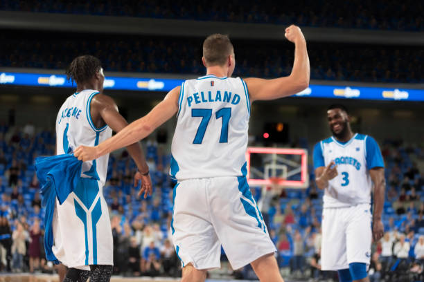 istock Basketball players celebrating 1256247215
