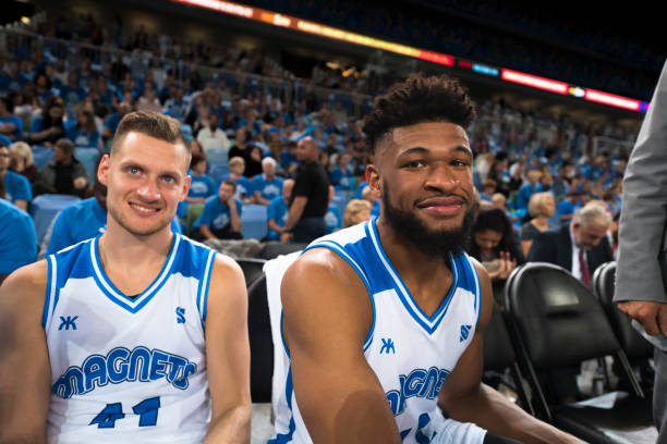 istock Basketball players sitting in stadium 1256247782